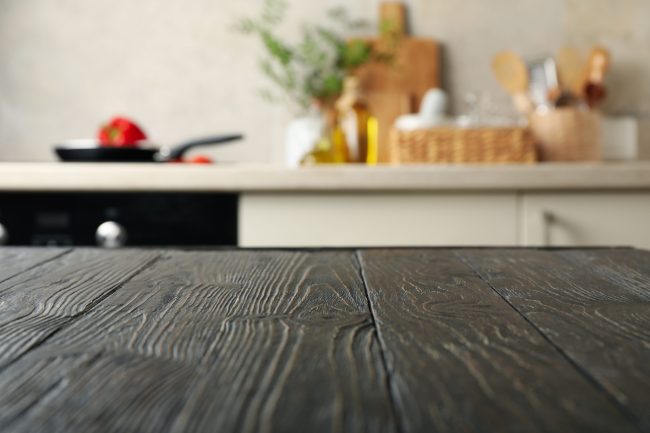 np_Wood table on blur kitchen room background_5wqOg6_standard_photo