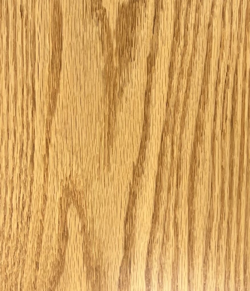 Red oak wood sample labeled OCS - Red Oak, showing warm tone and straight grain pattern