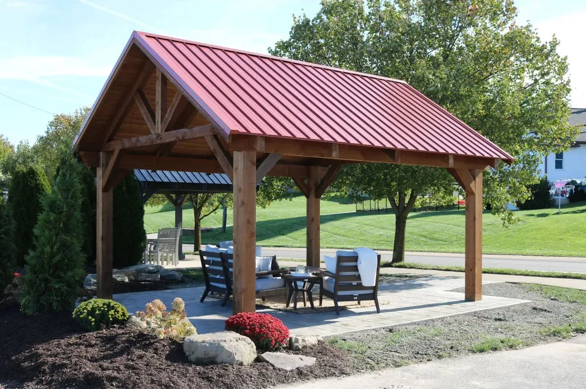 Berlin Gardens cedar pavilion with a metal A-frame roof over a furnished patio in Ohio