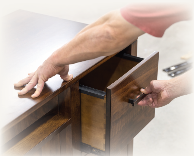 Amish craftsman building solid hardwood office furniture at A&L Furniture in Ohio