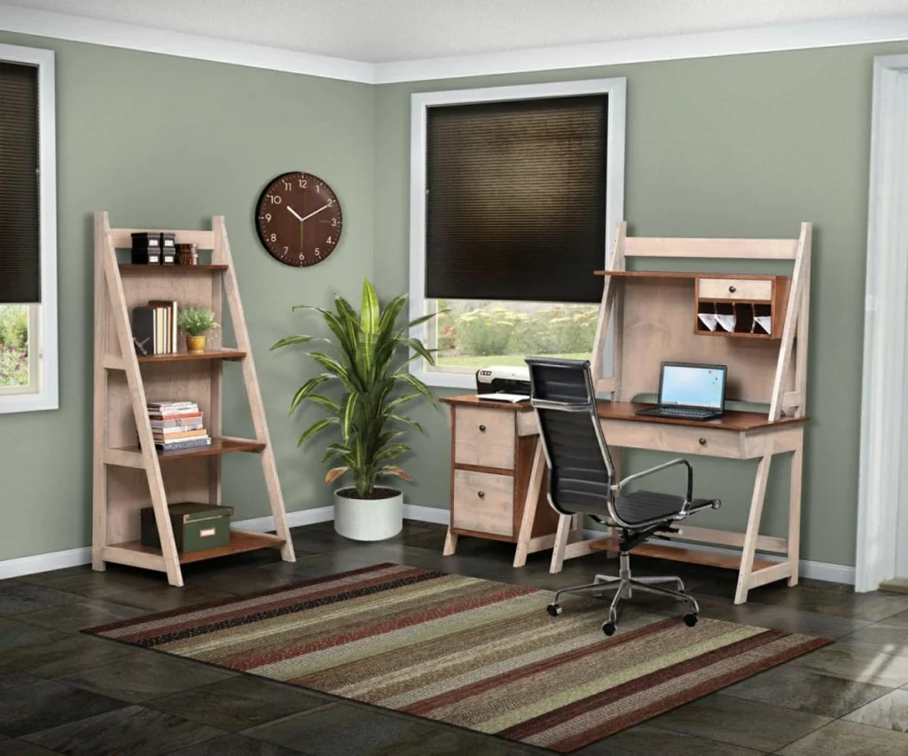Amish Timberline office collection, a light-wood leaning desk and matching ladder bookshelf in a modern green office.