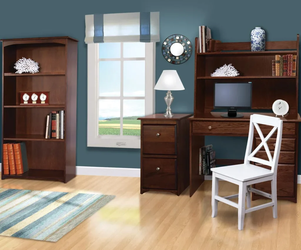 Amish Economy office collection staged in a blue home office with a wood desk, hutch, bookcase, and white side chair.