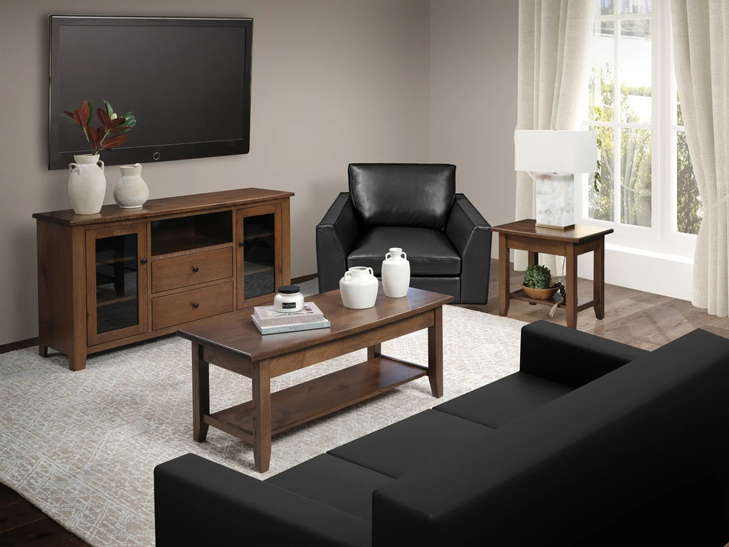 Amish Cody occasional collection, a medium-brown wood coffee table and matching end table styled in a living room with a leather chair and TV console.