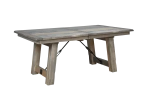 Amish Liberty solid-top trestle dining table in weathered gray wood with a metal stretcher.