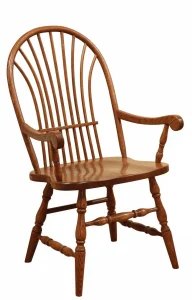 Amish Heritage Windsor-style dining arm chair in oak with a bowed spindle back.