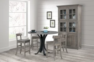 Amish Lakeside dining collection in gray-washed wood, staged with a round metal-base table, bar chairs, and a hutch.