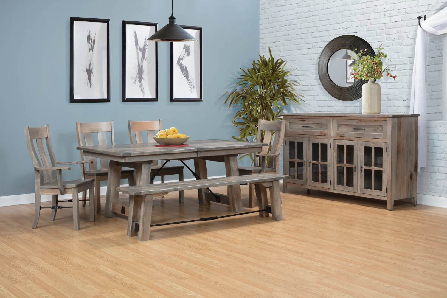 Amish Liberty dining collection in weathered gray reclaimed wood, shown with a trestle table, bench, chairs, and sideboard.