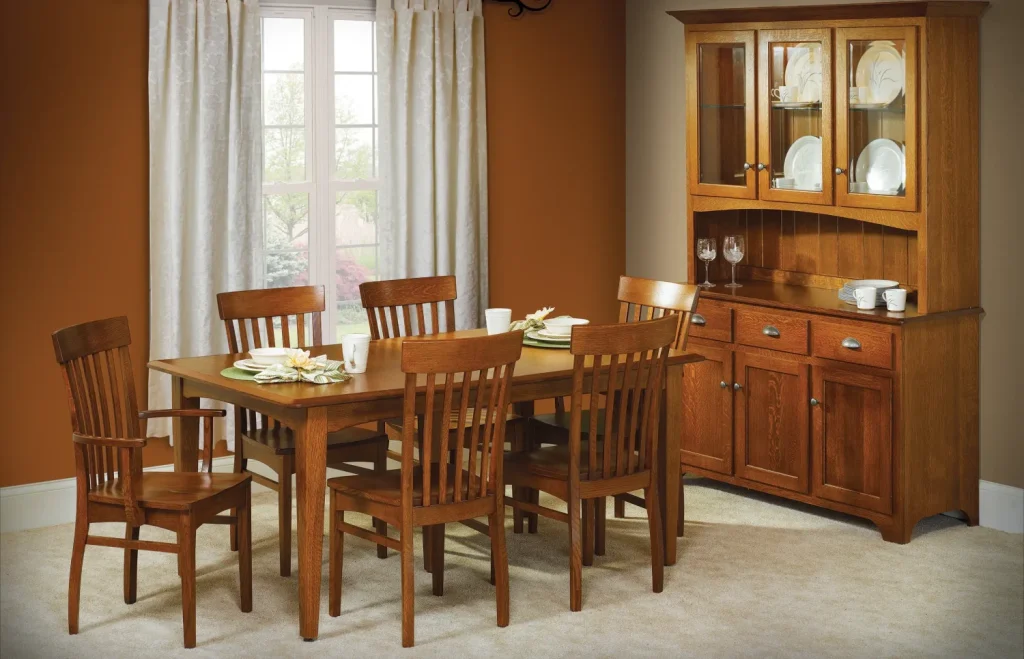 Amish Mary Ann dining collection in oak, staged in a warm room with a mission table, chairs, hutch, and buffet.