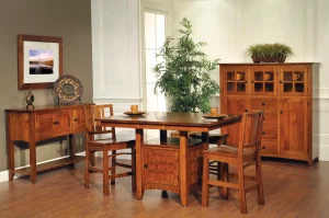Amish Blakely dining collection in warm oak, staged with a counter-height table, chairs, sideboard, and cabinet.