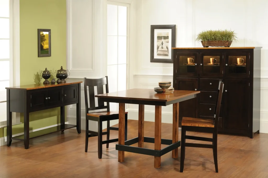 Amish Clanton dining collection in a two-tone black finish, staged with a counter-height table, chairs, server, and hutch.