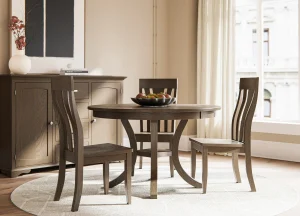 Amish Oak Harbor dining collection in a dark two-tone finish, staged with a round table and chairs.