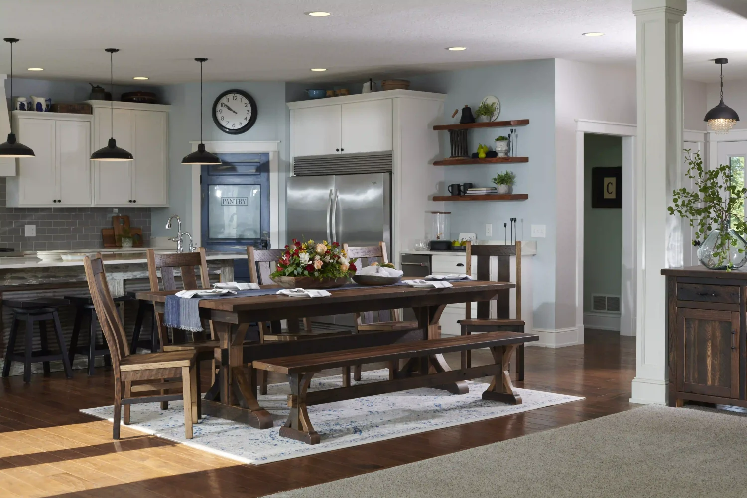 Amish Bristol dining collection staged with a rustic reclaimed-wood table, bench, and chairs in a kitchen.
