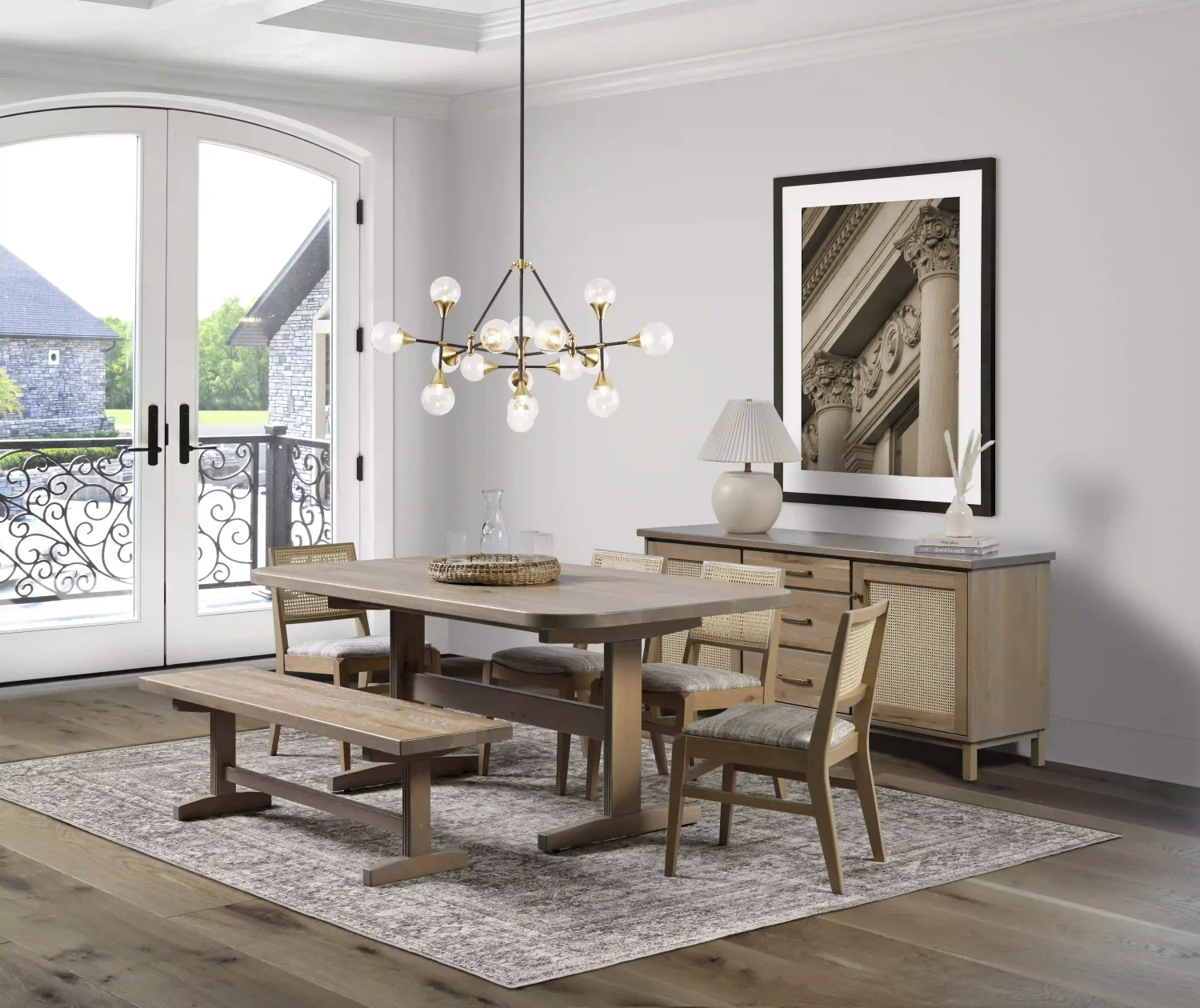 Amish Provence dining collection staged with a light-wood table, bench, upholstered chairs, and a server in an elegant room.